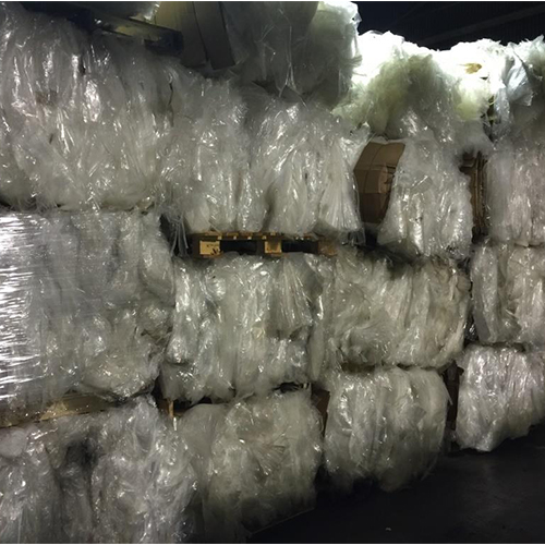 LDPE film scrap bundles piled high on a shelf at whole sale prices.