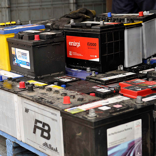 A Variety of lead battery and batteries brand scrap in a plastic crate at cheap prices.