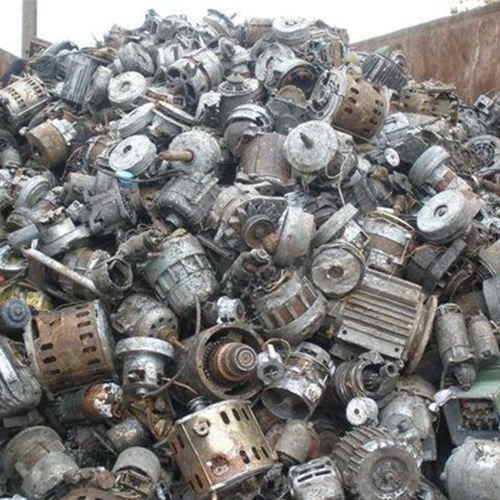 Big pile of electric motor scrap mixed with other metal scrap